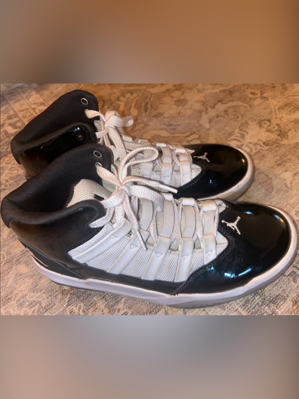 Jordan 11 Black and White Patent Leather High-Top Sneakers